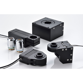 Ultra-precision positioning piezo stage for objective lens focusing