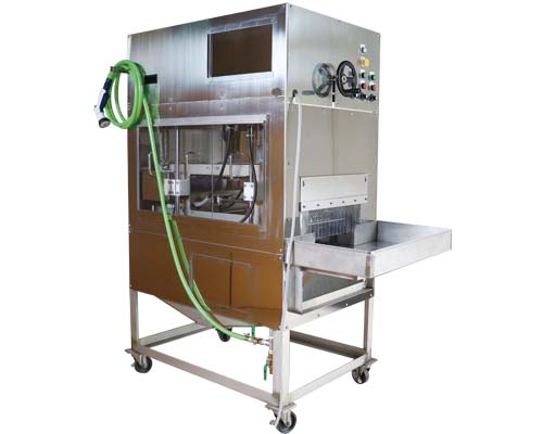 自動うろこ取り機(水圧式)