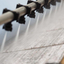 Production of wide and long composite sheets using spray coating.