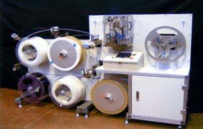 『チューブ切断巻取装置』